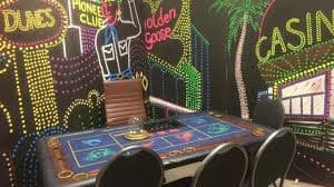 Live dealer studio with croupier at blackjack table